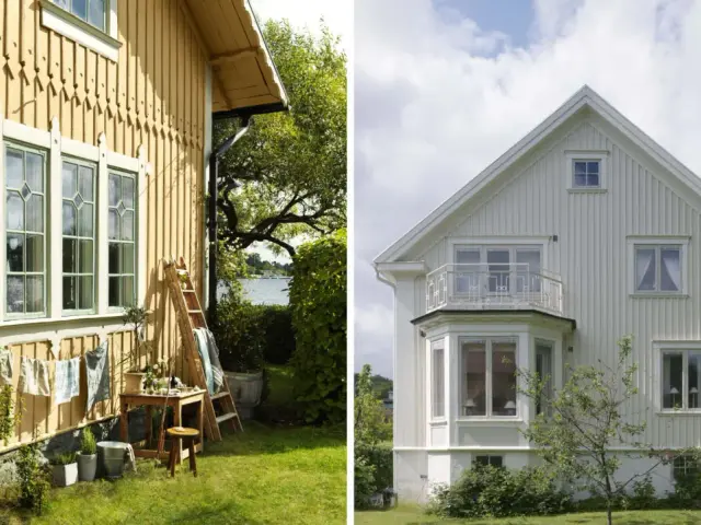 Gula huset är redo att måla om huset. Vitt hus med balkong och vackra fönster.